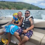 Boat renters and baby on boat at Horsetooth Reservoir